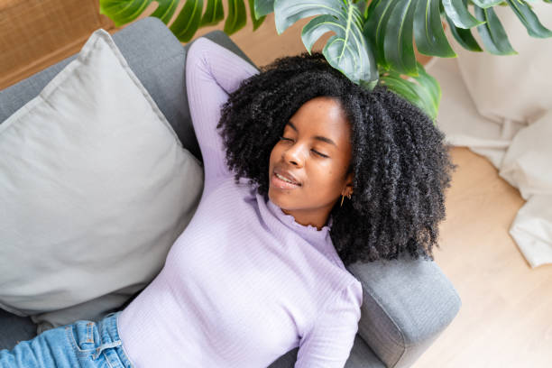 istock Serene woman relaxing at home 2154460445