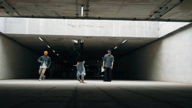 istock Long shot of hipster group dance together while perform b-boy dance. Sprightly. 2154462444