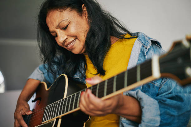 istock Mature Woman Learning Guitar 2154467130