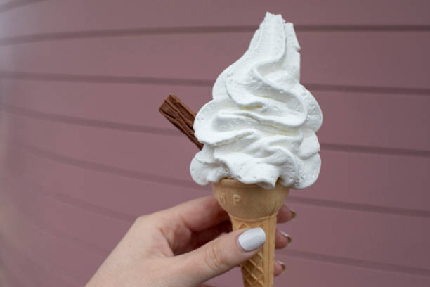 3d rendering of Ice cream cone and cloud. Abstract background, minimal summer concept. Surrealism. Pantone 2021 colors Ultimate Gray and Illuminating Vibrant Yellow.