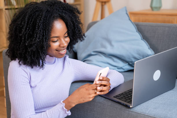 istock Young woman working and texting from home 2154468152