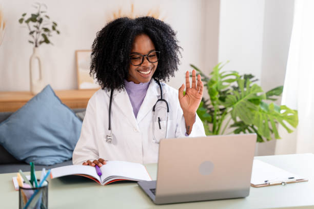 istock Friendly doctor waving during a virtual consultation 2154468407