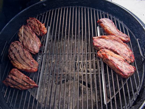 Sirloin cap steaks, also called picanha, cooked on the old-fashioned kettle charcoal grill