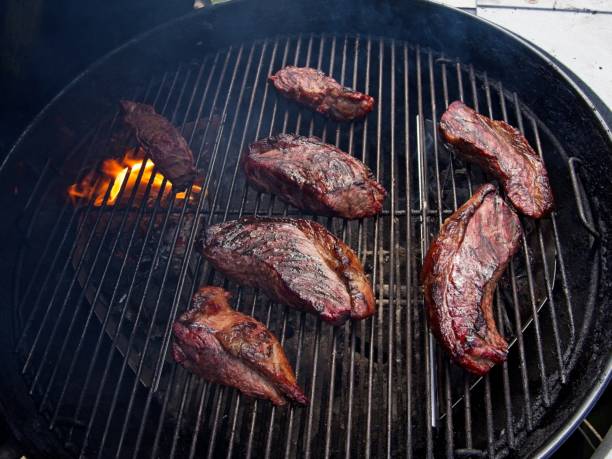 istock Sirloin cap steaks, also called picanha, cooked on the old-fashioned kettle charcoal grill 2154469224