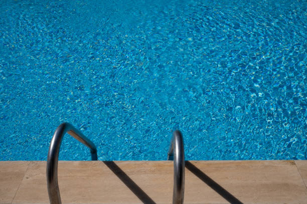 istock Outdoor swimming pool water with handrail 2154469626