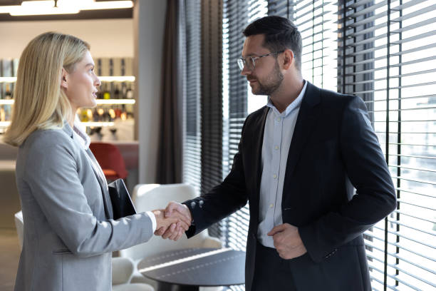istock Business woman manager handshaking greeting client in office 2154471889