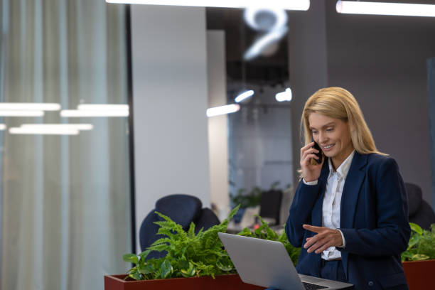 istock Confident woman working on laptop and having professional conversation 2154472023