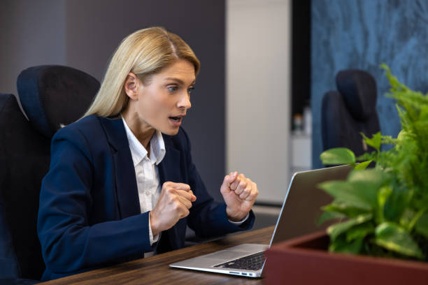 istock Shocked businesswoman entrepreneur in office using laptop at work 2154472045