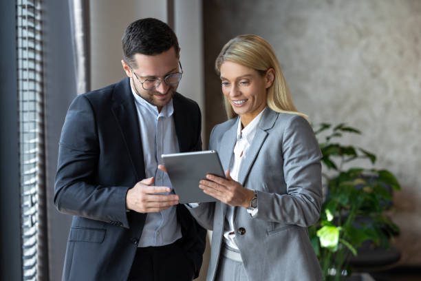 istock Business people enjoying work together using tablet for online project discussing 2154472116