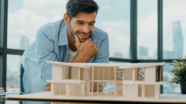 istock Civil engineer looking while planing design house construction. Tracery 2154472787