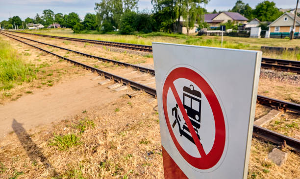 istock Warning Sign Prohibiting Access to Railway Tracks Under the Bright Sunlight 2154473855