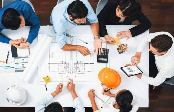 istock Diverse group of civil engineer and client working on architect. Prudent 2154477485