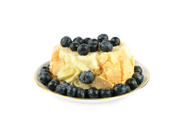 Meringue cake with blueberries isolated on white background.