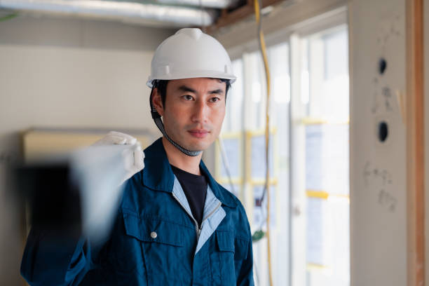 istock Carpenters bringing materials to the site 2154480455