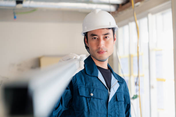 istock Carpenters bringing materials to the site 2154480467