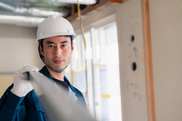 istock Carpenters bringing materials to the site 2154480498