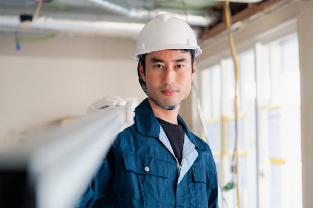 istock Carpenters bringing materials to the site 2154480523