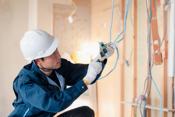 istock Electrician working on wiring at construction site 2154485161