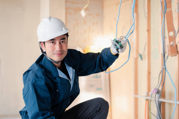 istock Electrician working on wiring at construction site 2154485164