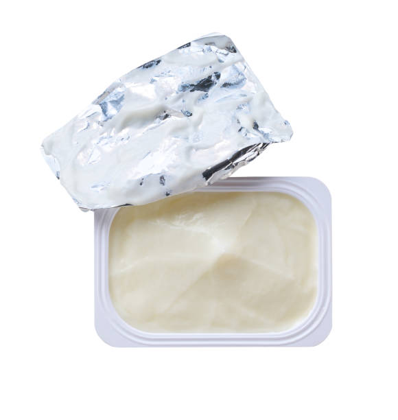 istock Open packing with yoghurt or tasty dessert isolated on a white background. Top view. 2154490738