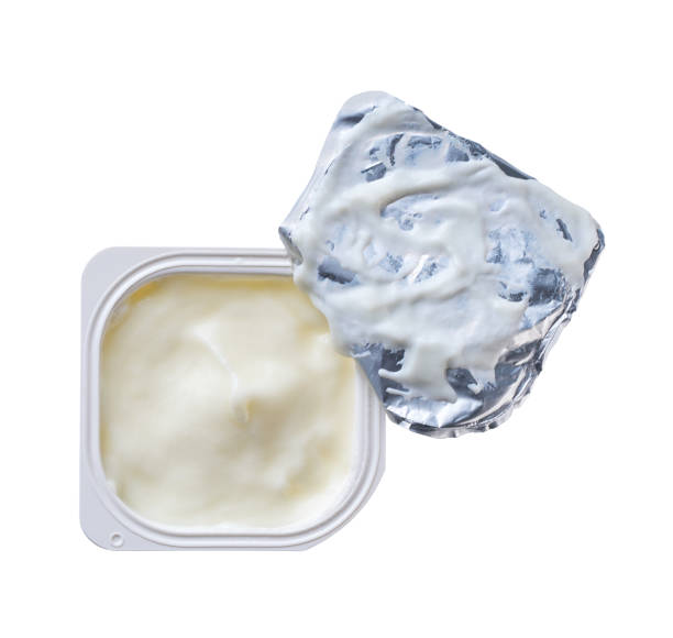 istock Open packing with yoghurt or tasty dessert isolated on a white background. Top view. 2154490770