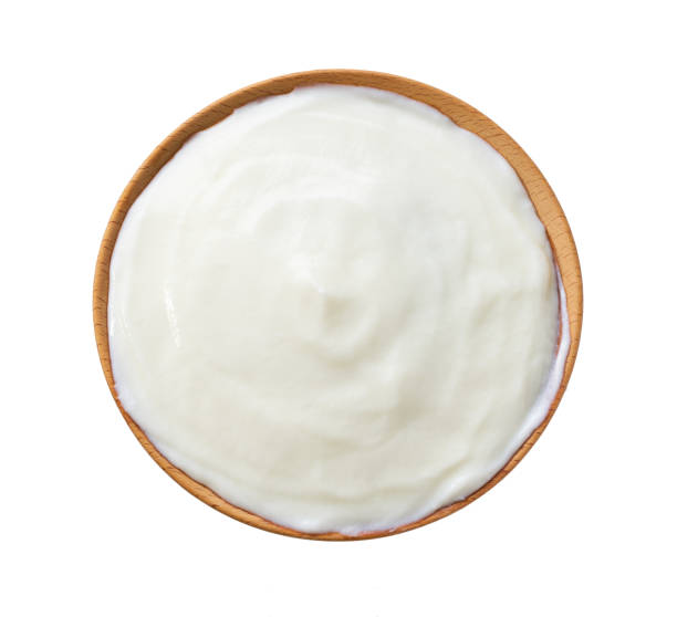 istock probiotic yogurt  in a wooden bowl isolated on a white background, top view. 2154490791