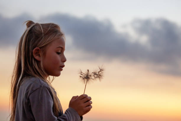istock Cute Little Boy with Dandelion Flower 2154490805