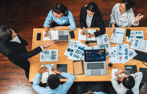 istock Wide top view diverse analyst team analyzing financial data. Habiliment 2154491784
