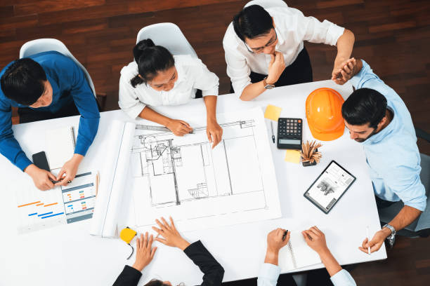 istock Diverse group of civil engineer and client working on architect. Prudent 2154492227