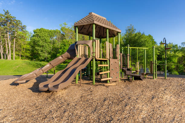 istock Unidentified typical elementary school, municipal park, playground with engineered wood fiber safety fall surface. 2154493569