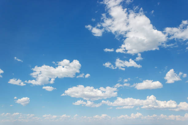 istock Blue summer sky with curly clouds stretching to the horizon 2154497188