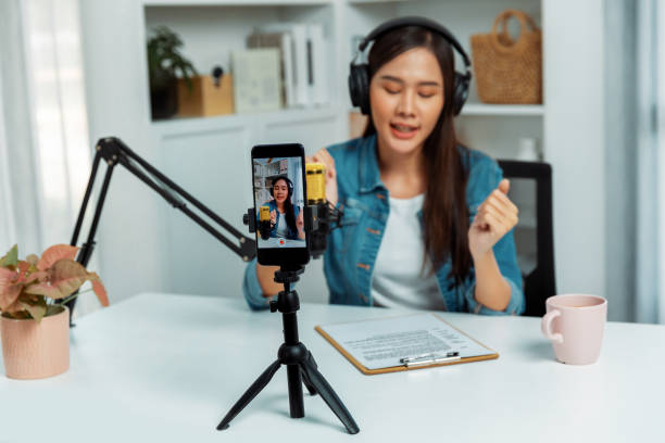 istock Host channel talking in broadcast wearing headset smartphone record. Stratagem. 2154497639