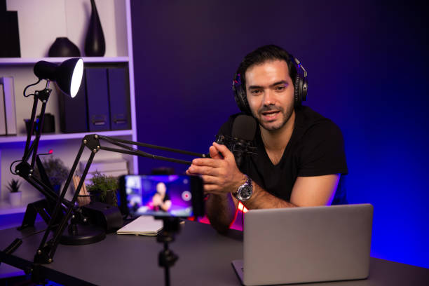 istock Broadcaster talking to listener on live streaming, recording phone. Surmise. 2154503242