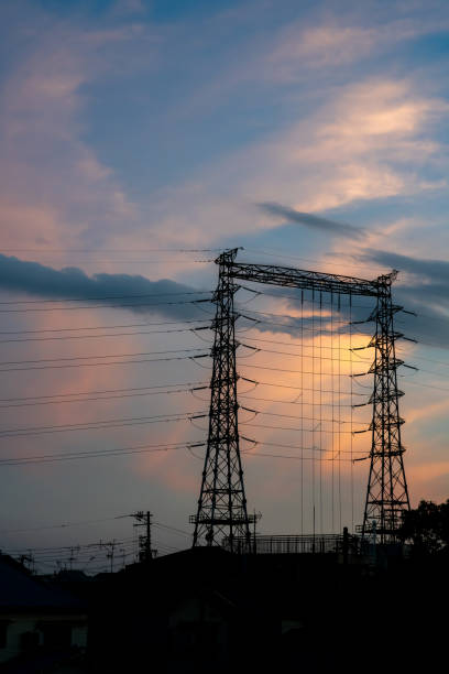 istock sunset and steel tower 2154507722