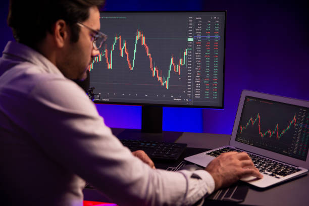 istock Smart trader concentrating on dynamic stock exchange on pc and laptop. Surmise. 2154508292