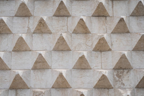 Photo background texture, interesting concrete building facade with bulges. Close up photo