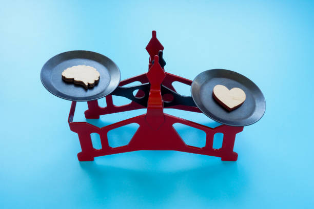 istock Scales with heart and brain. Emotional intellect. 2154510355