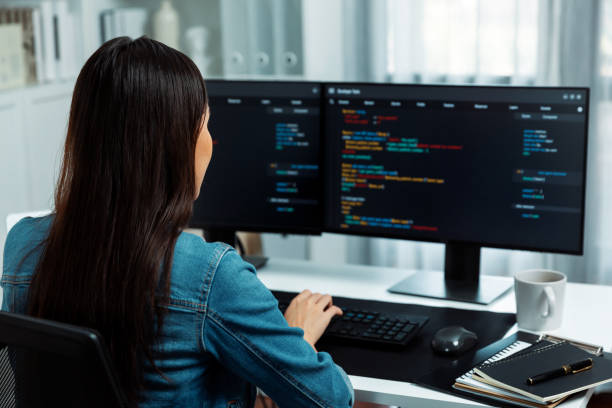 istock Young Asian in IT creating with typing online information on pc. Stratagem. 2154518297