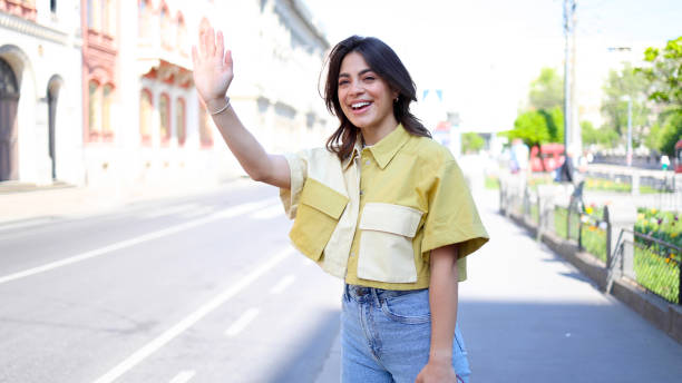istock Latin young woman calling a cab 2154519950