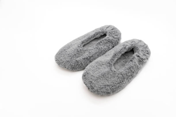 istock Fluffy gray home slippers isolated on white background 2154521184