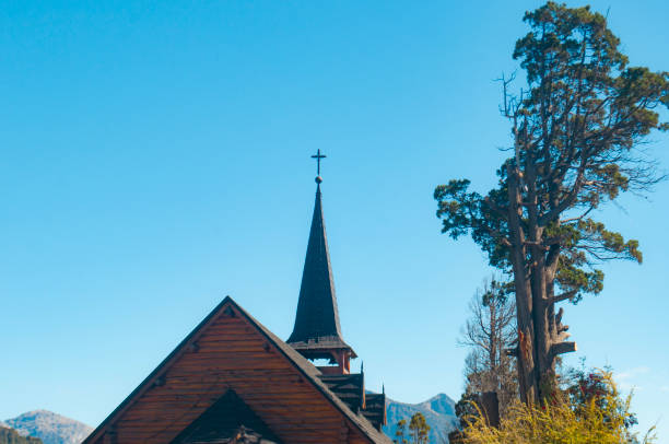 Aspen Chapel in Aspen, Colorado with snow-covered mountains in background on April 10, 2025.