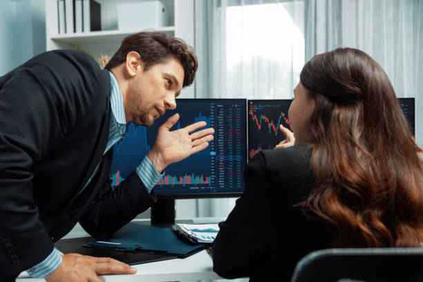 istock Two business traders discussing business statistic on report paper. Postulate. 2154522768