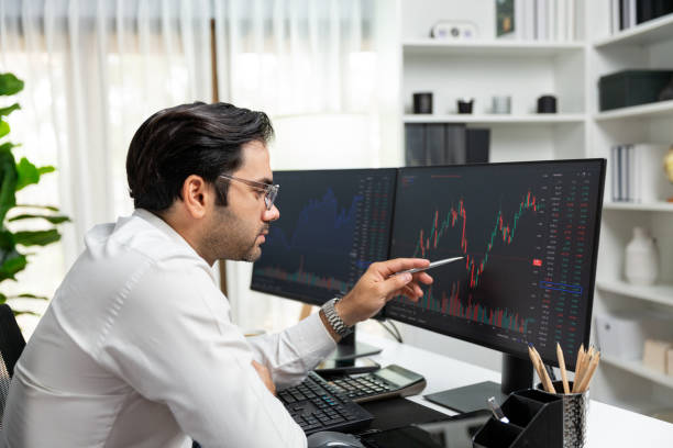 istock Trader analyzing in dynamic stock exchange investment screen on pc. Surmise. 2154524623