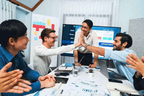 istock Happy office worker achieving business task on time and on schedule. Prudent 2154525411