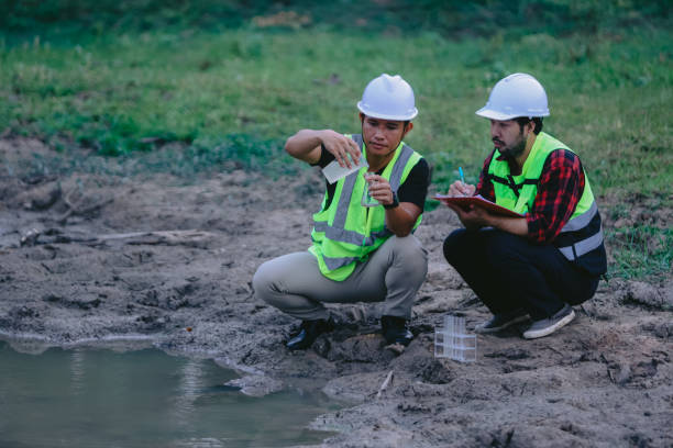 istock Environmental engineers work at wastewater treatment plants,Water supply engineering working at Water recycling plant for reuse,Technicians and engineers discuss work together 2154525687