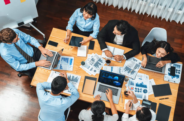 istock Wide top view diverse analyst team analyzing financial data. Habiliment 2154526173