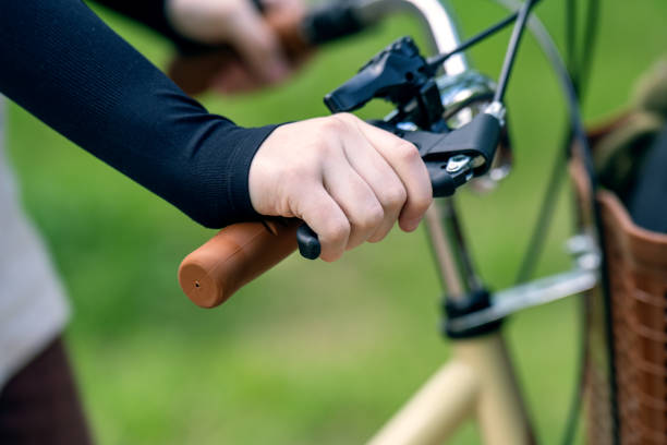 istock Child hand mistakenly pressing on a bicycle handbrake lever 2154531234