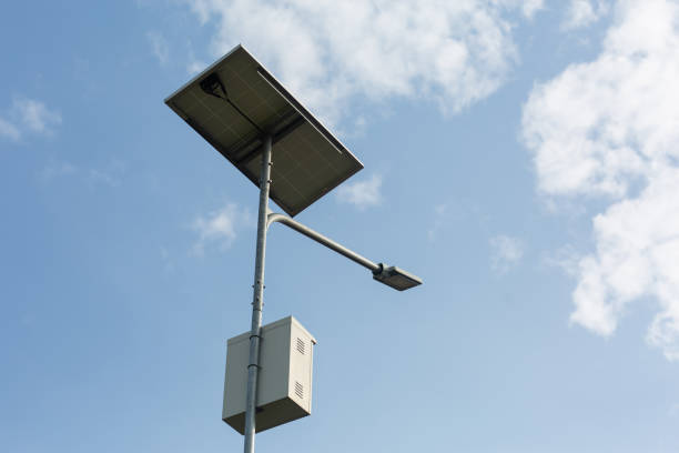 Electric poles illuminate the road using solar energy.