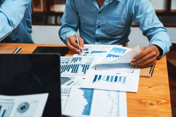 istock Group of business analyst team analyzing financial data report. Habiliment 2154534845