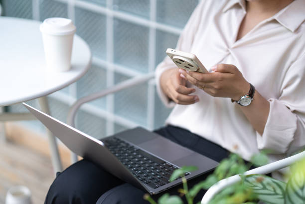 istock business woman using mobile phone 2154535243